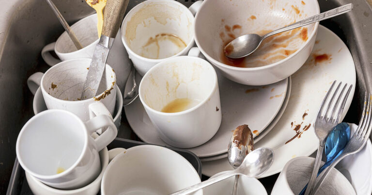 Why Letting Dishes Pile Up Could Be a Sign of Something Deeper, According to Psychology